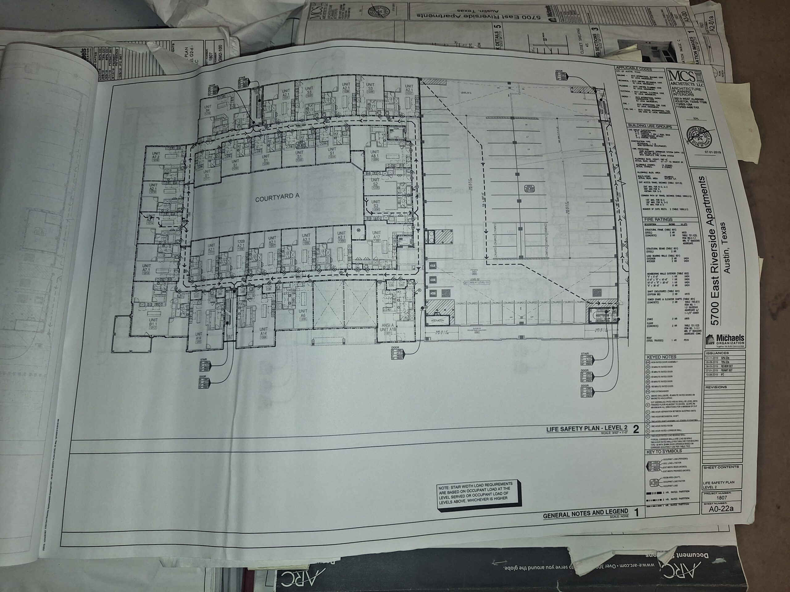 Commercial fire alarm plans and permit documentation for Travis and Williamson County ESD inspections.